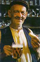 Photograph of a Yorkshire man enjoyign a pint and a chunk of cheese